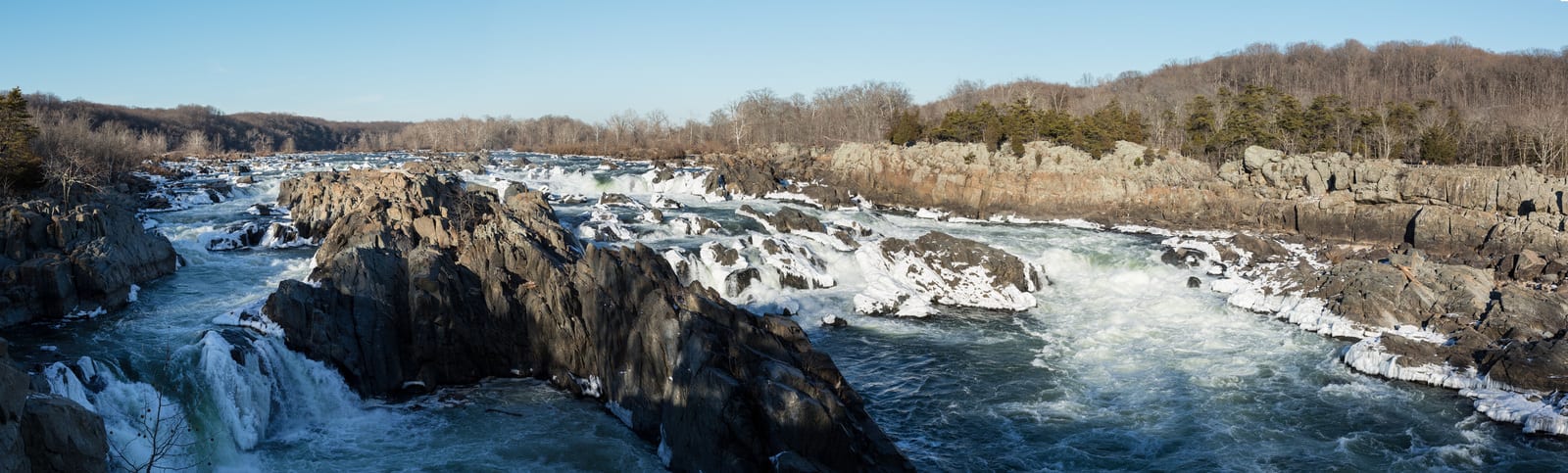 Great Falls Park in Virginia showcases cascading waterfalls amid rugged rocks and winter foliage, with ice formations highlighting the dramatic scenery, popular for hiking and photography. | Houfy — No Fees, Book Direct