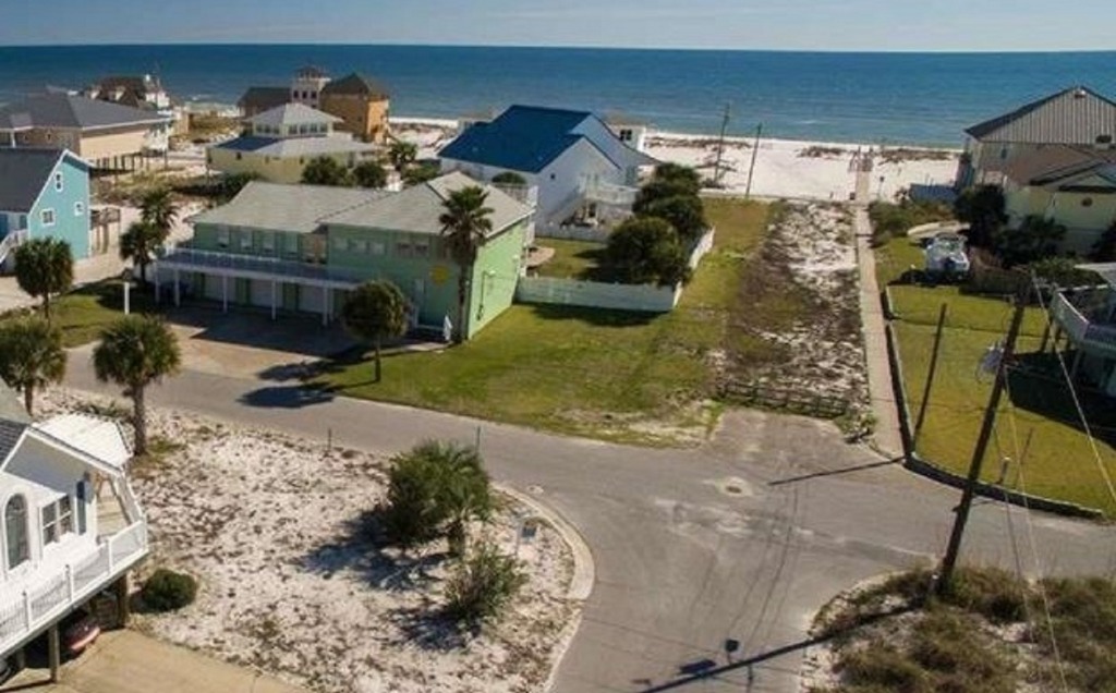 The access and access parking are public.  The access runs along the west side of the house.