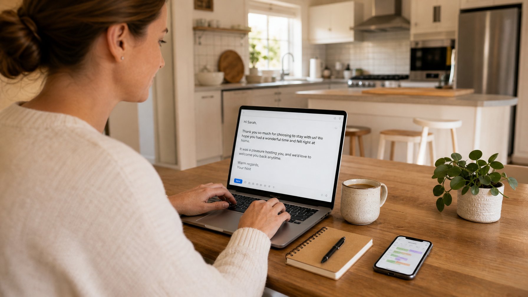 Vacation rental host composing a post-stay thank-you email to a past guest, with a booking calendar open on her phone