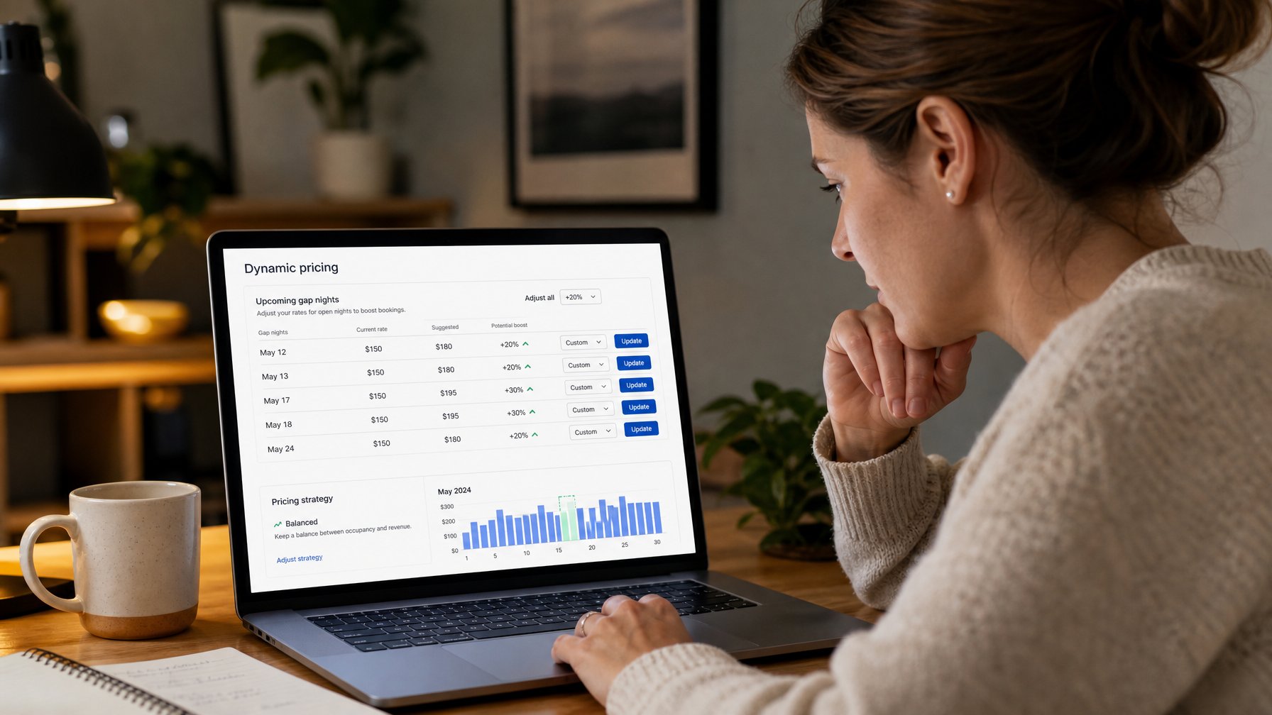 Vacation rental host reviewing a dynamic pricing dashboard on a laptop to adjust rates for upcoming gap nights and capture last-minute bookings