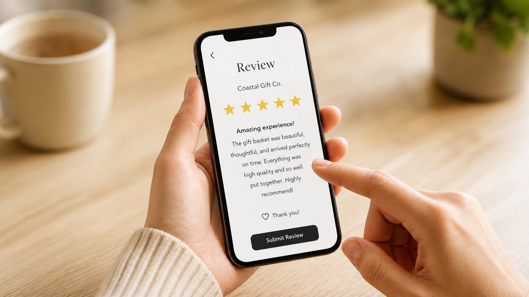A host and guest with a smartphone showing a 5-star rating and gold stars on a white app screen, on a warm wood table surface