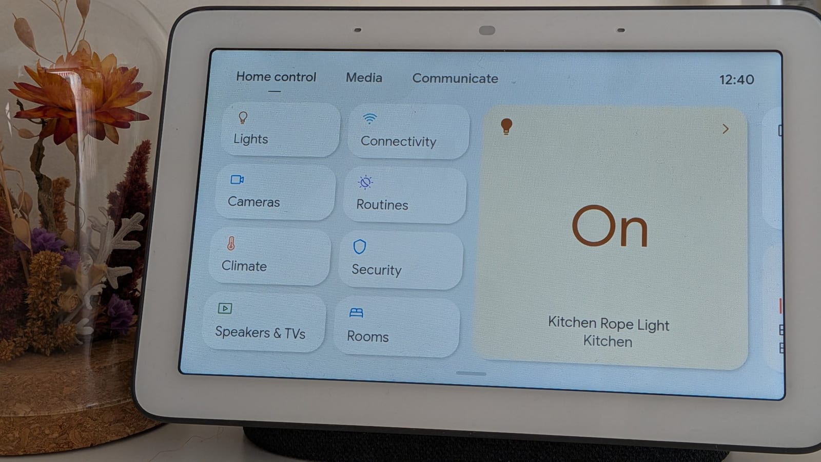 This Google Nest Hub smart display serves as the central command center for our guest-forward home automation.