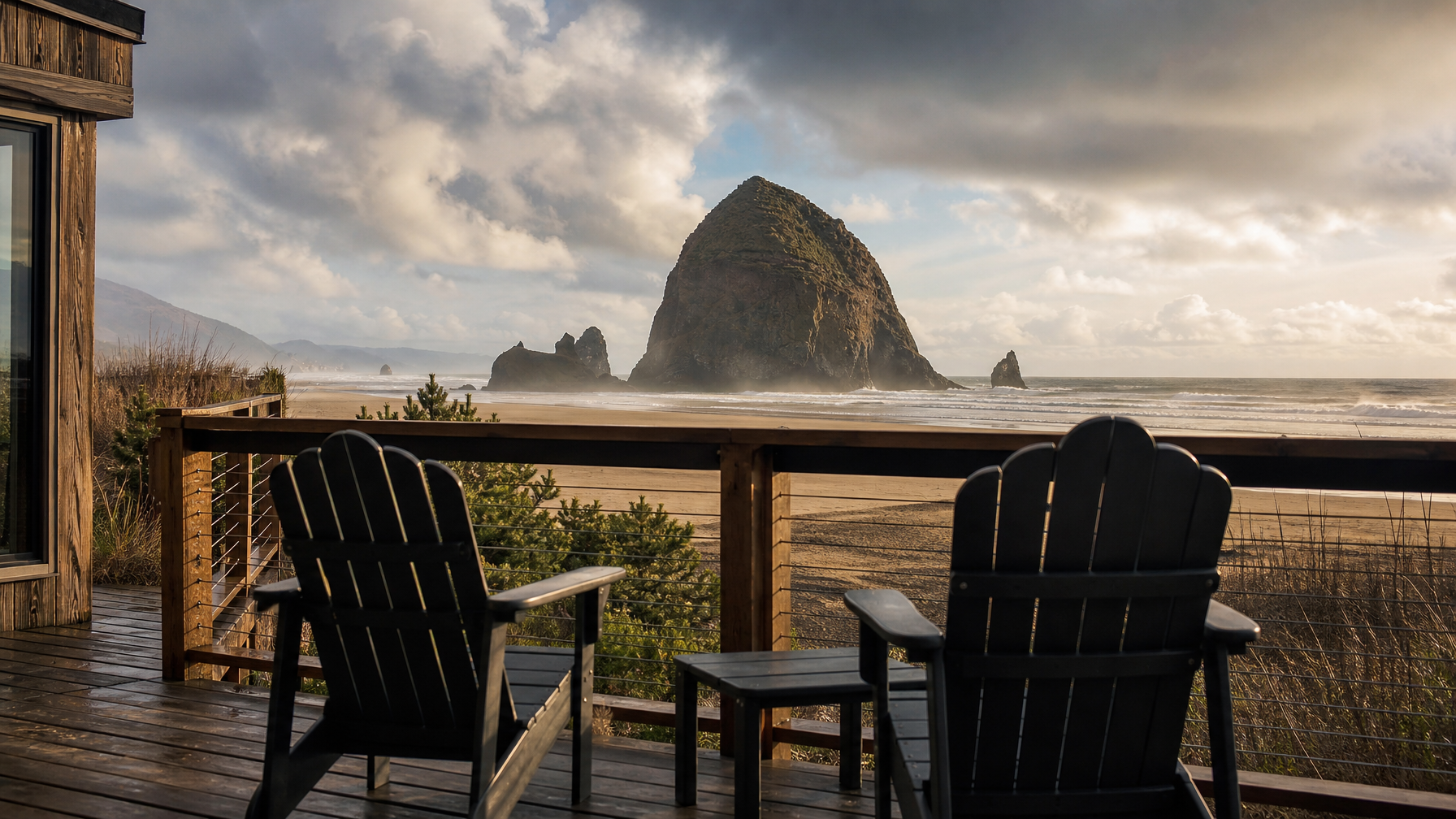 An Oregon Coast vacation rental with a deck view of Haystack Rock at Cannon Beach representing the most iconic Pacific Northwest coastal destination for 2026 guests