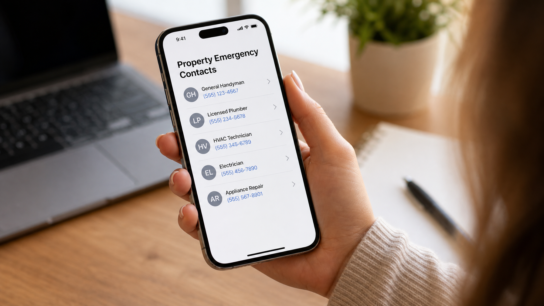 A vacation rental host's phone showing an emergency maintenance contacts list with plumber electrician HVAC and handyman numbers ready for guest stay issues