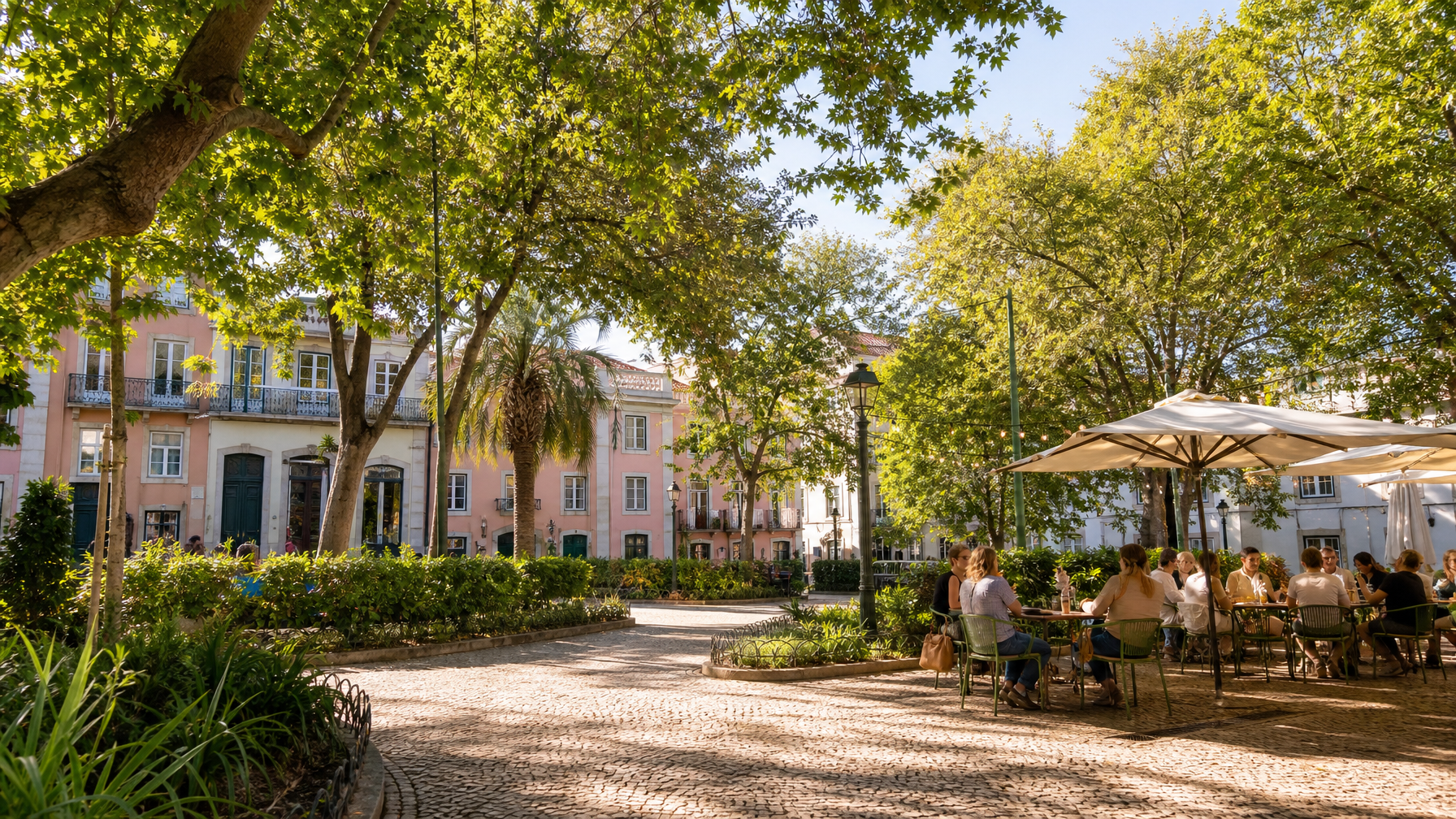 Príncipe Real Lisbon garden square near vacation rentals with cafe seating and pastel buildings