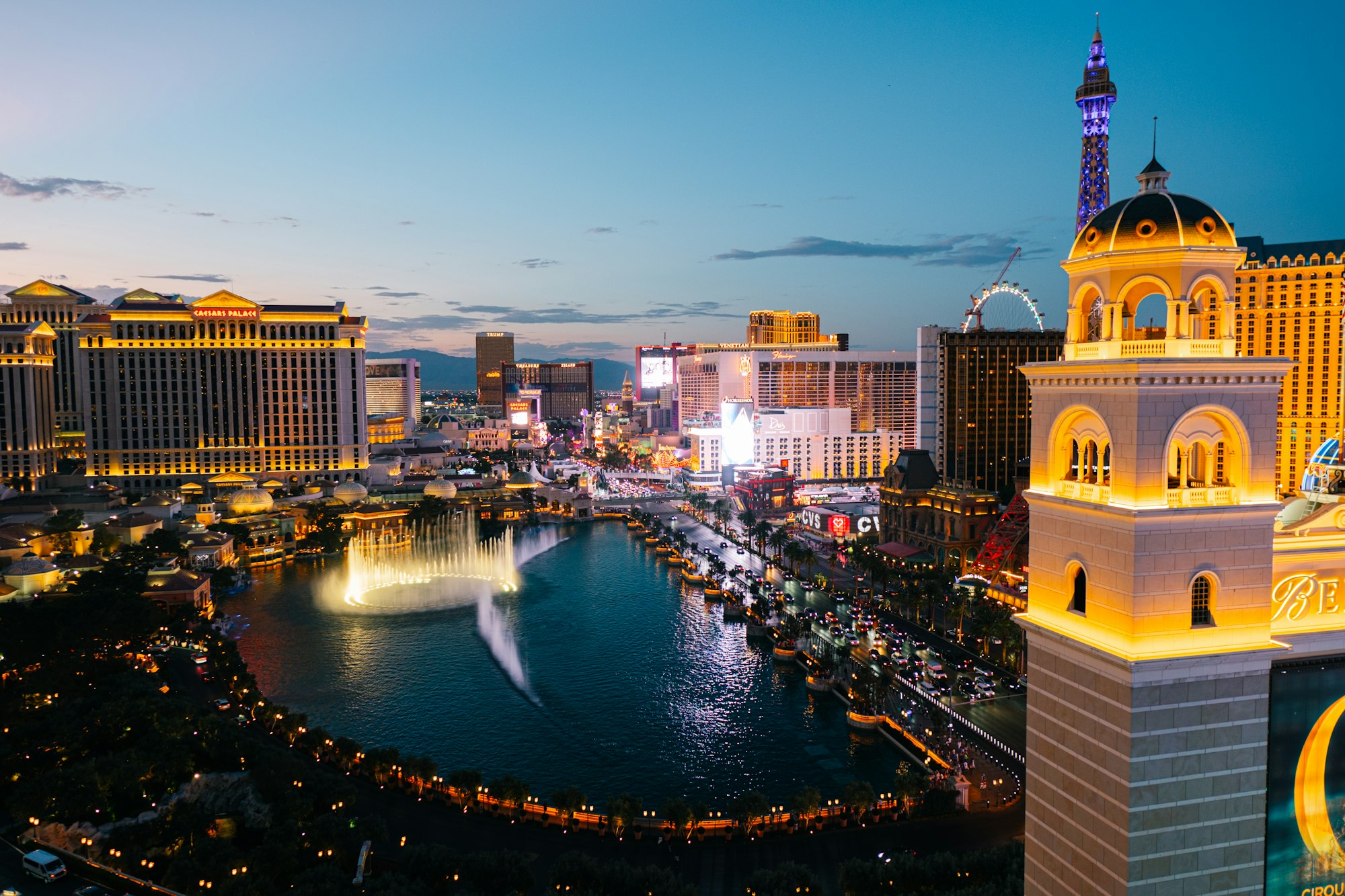 Las Vegas Boulevard at night with dense traffic, neon, and hotel towers