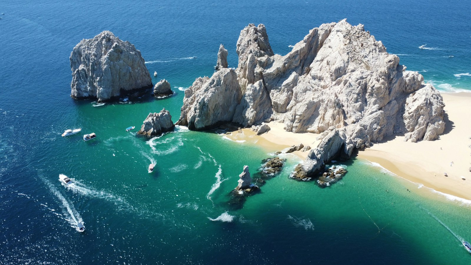 Aerial view of Land's End rock stacks and turquoise shallows off Cabo San Lucas