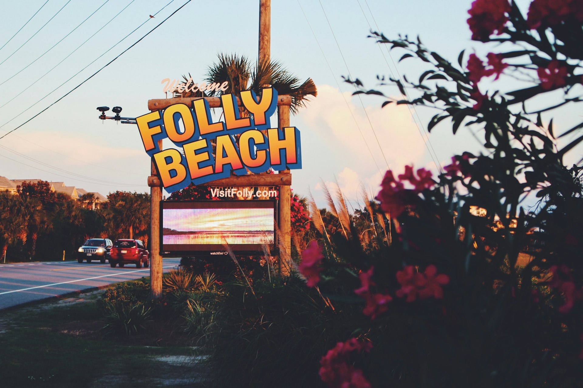 Folly Beach roadside welcome sign under open sky