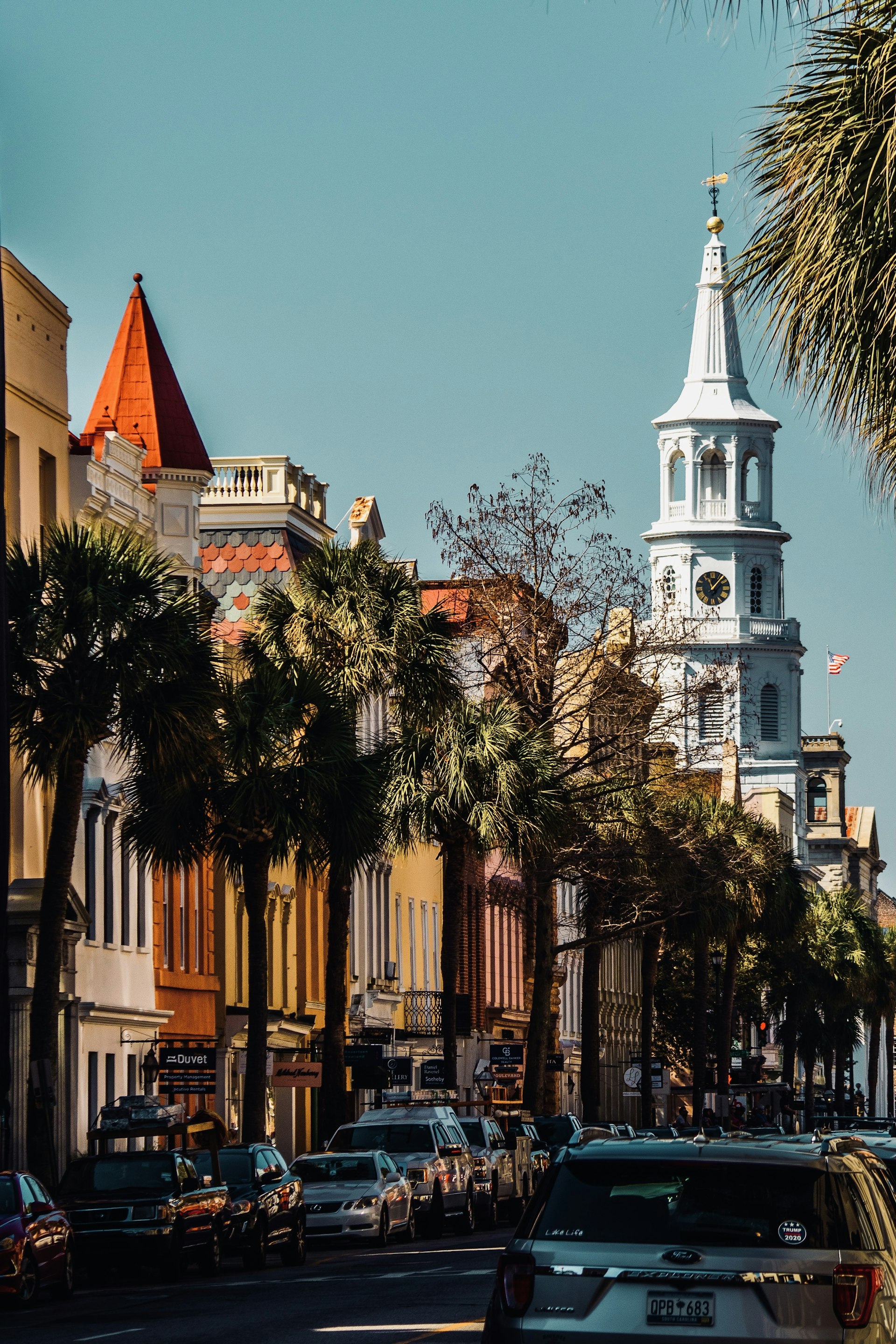 Charleston street with a church steeple rising above the rooftops