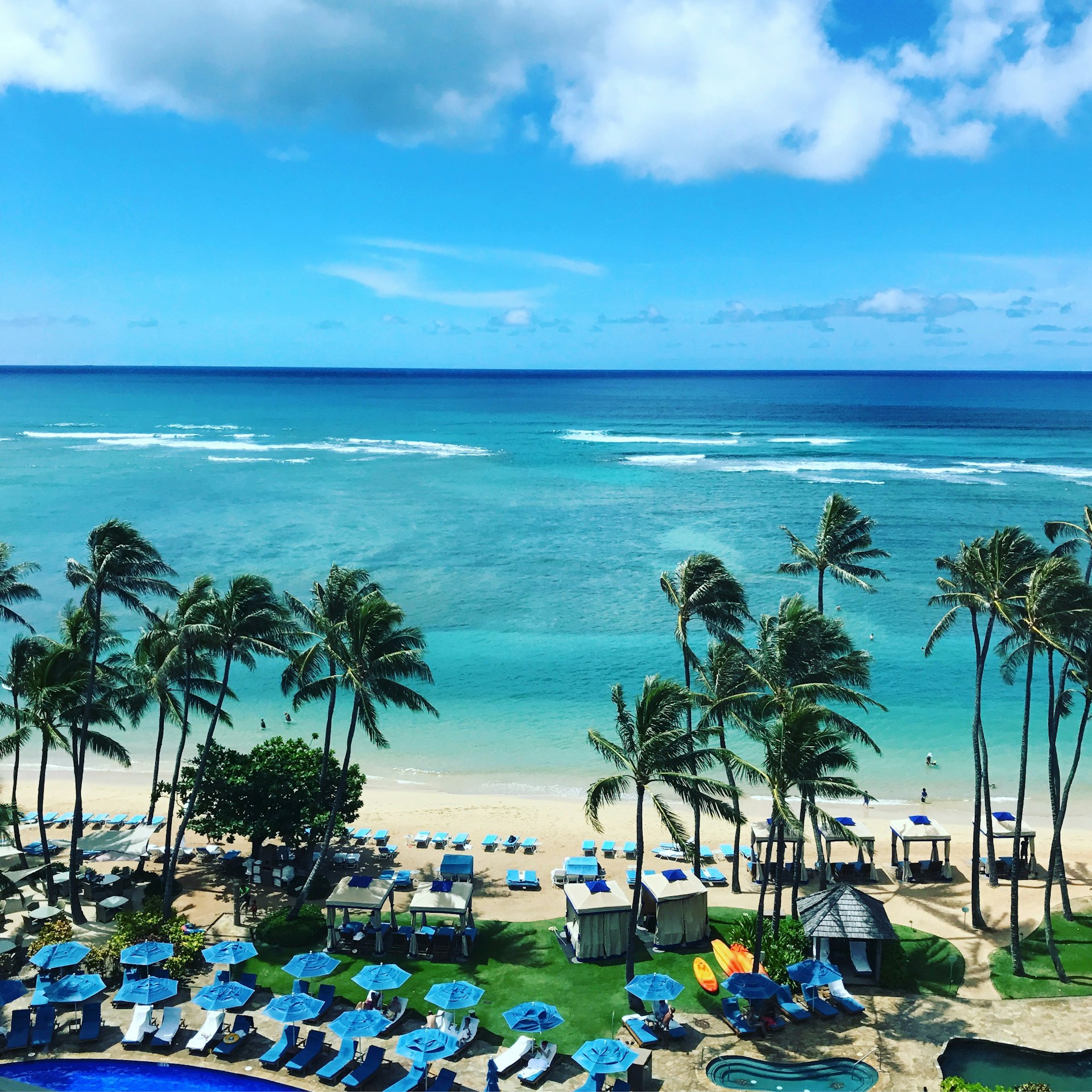 Aerial view of an oceanfront resort and lagoon on the Oahu coast