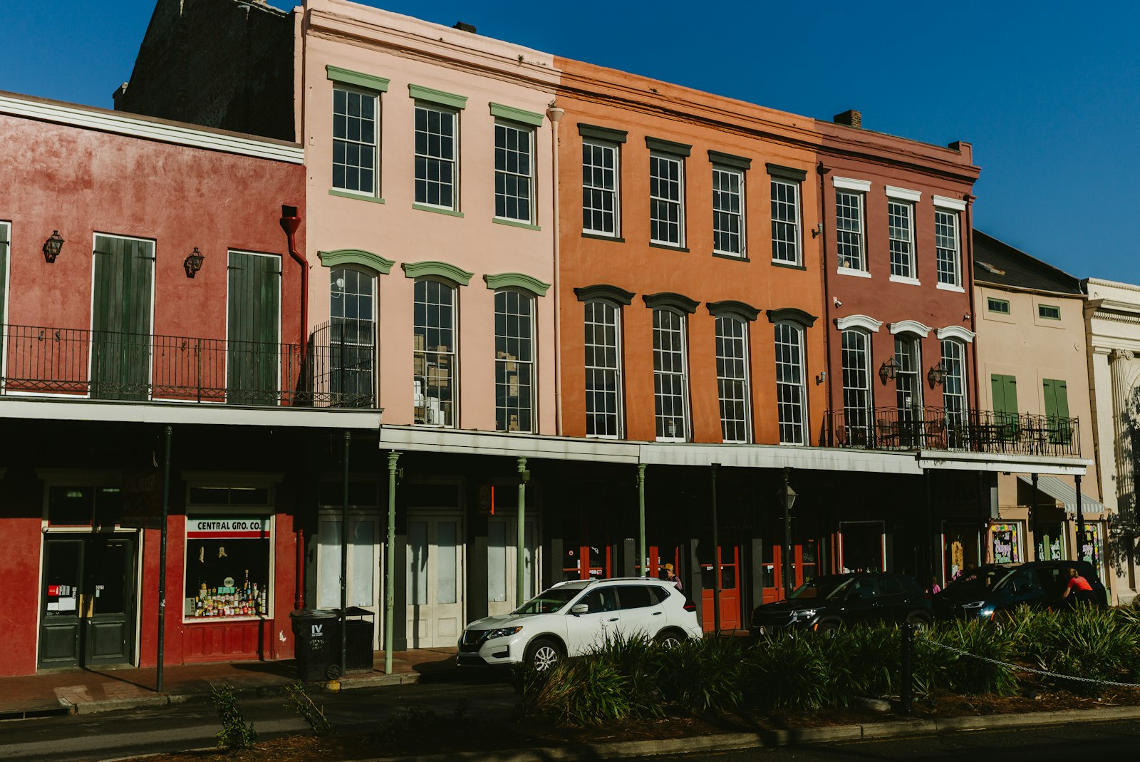 Colorful historic houses lining a sunny New Orleans street