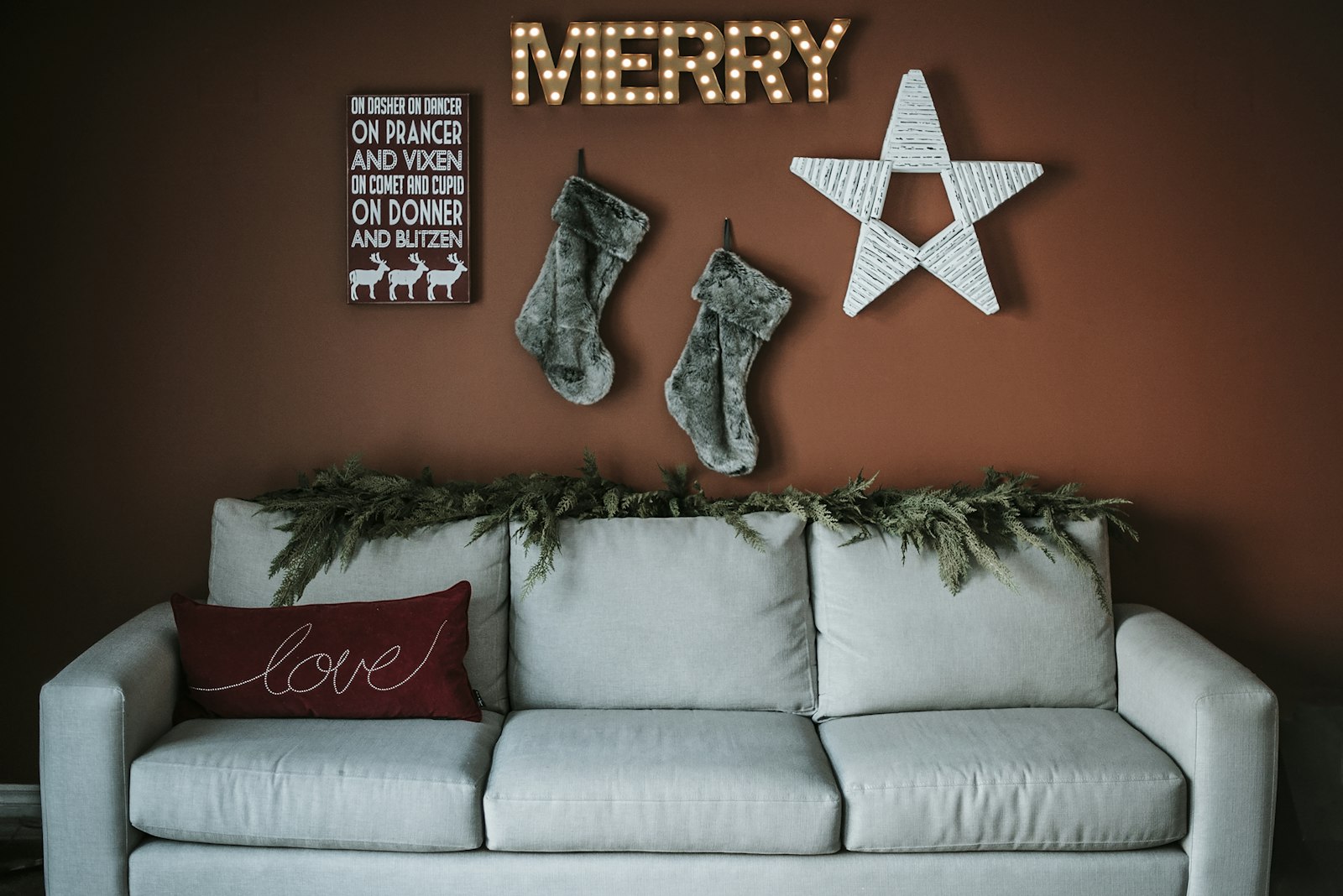 Living room decorated for the holidays with a tree and warm lamps