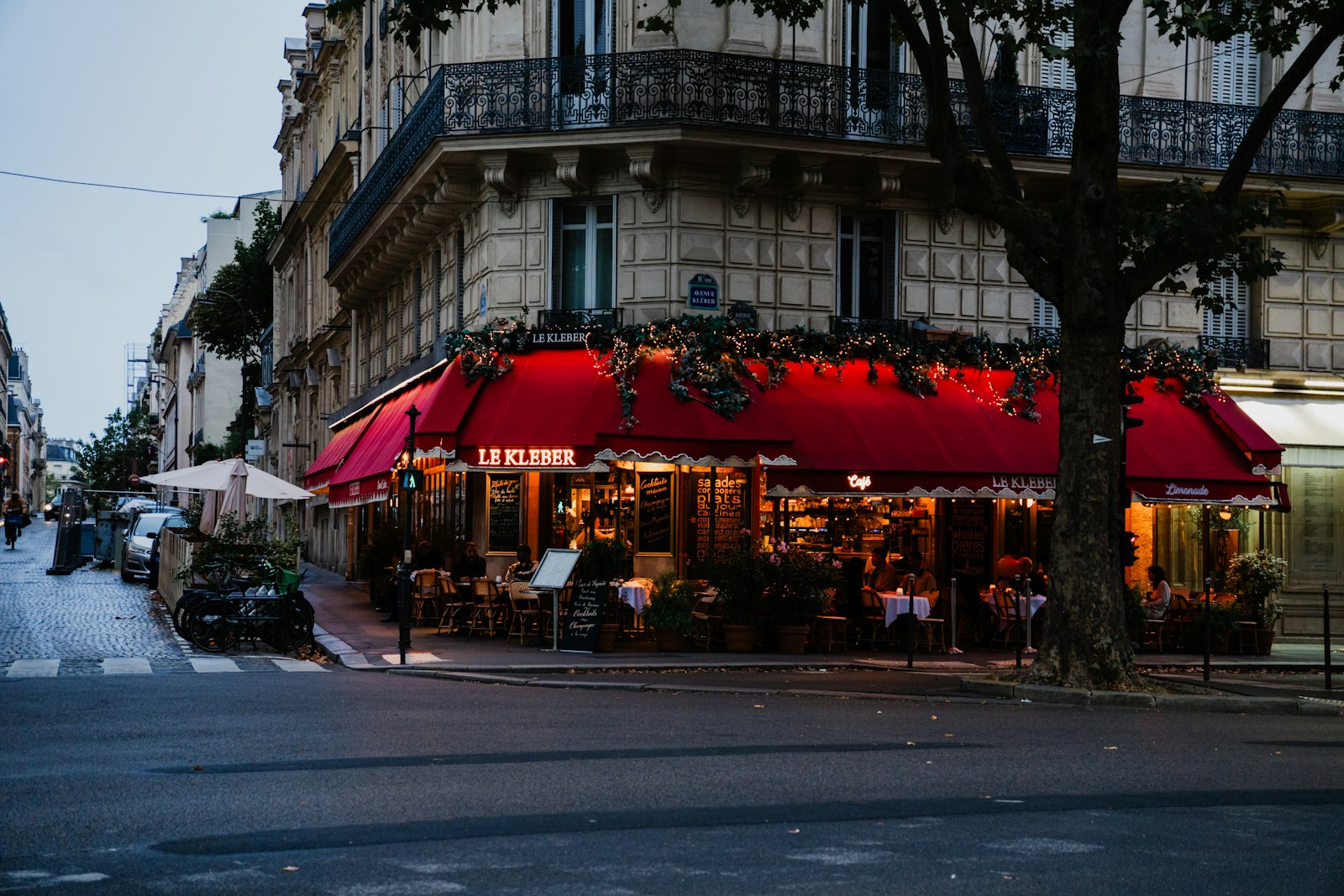 Parisian café with a red awning on a quiet street