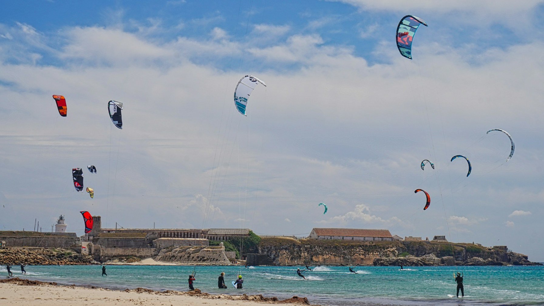 Kitesurfers on the wide sandy beach at Tarifa on Spain's Costa de la Luz