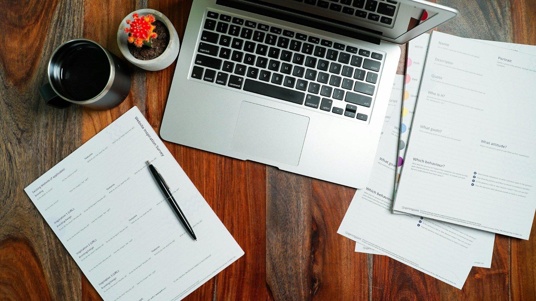 An open laptop on a wooden desk in a quiet workspace