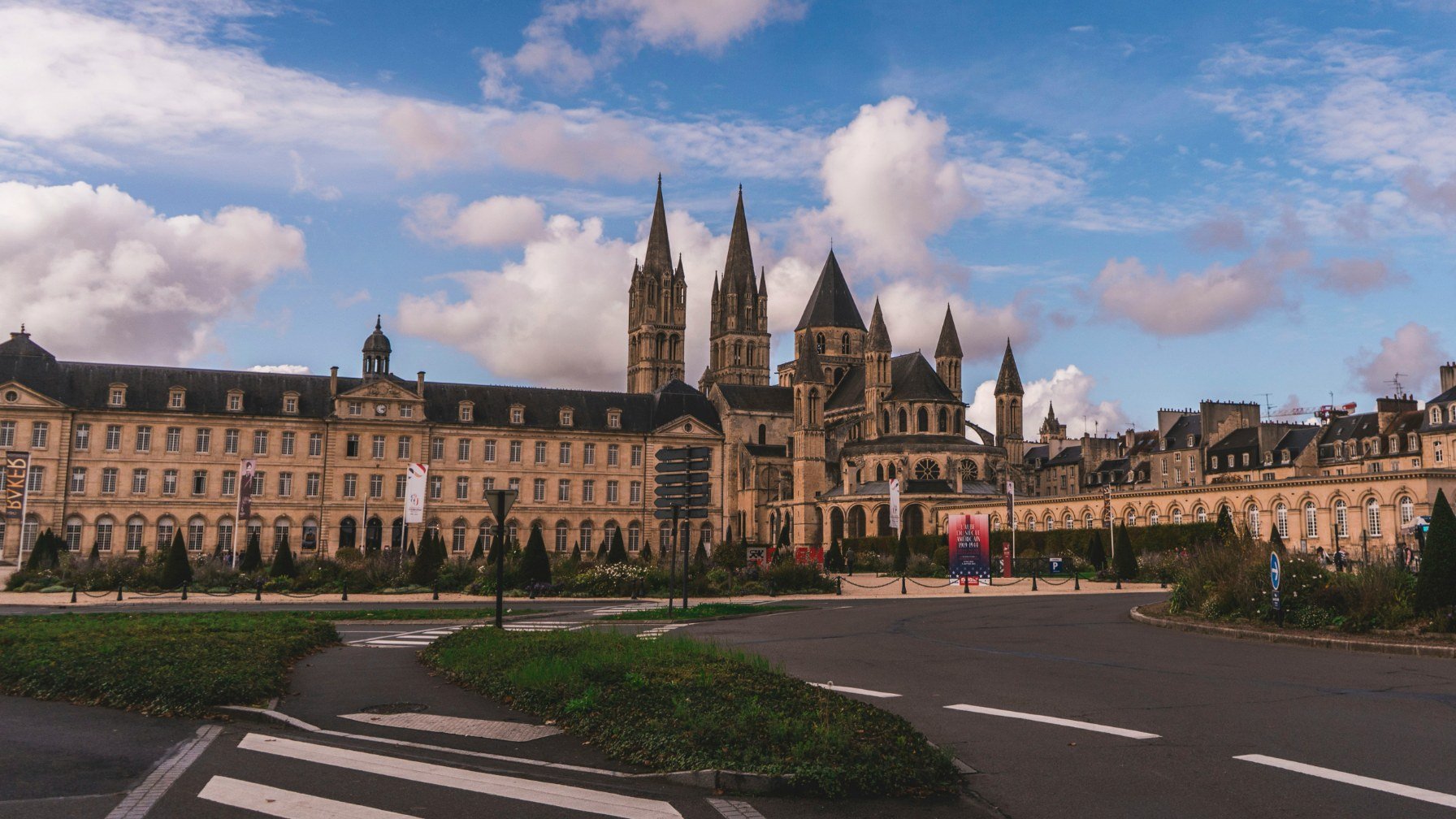 The Abbaye aux Hommes in Caen, its twin spires rising behind the long pale stone abbey buildings