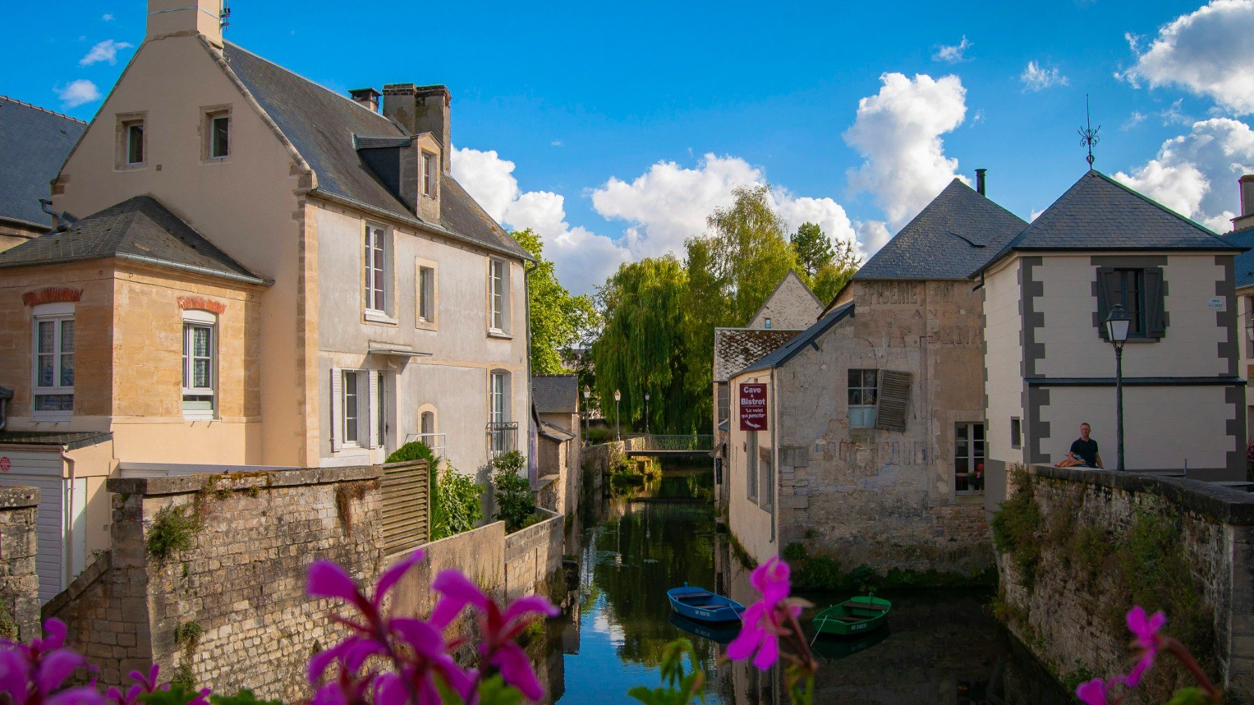 The Aure canal running between the old stone houses of Bayeux
