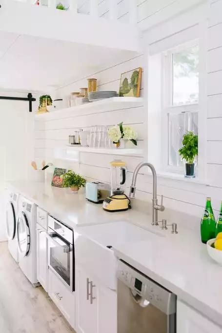 Fully stocked kitchen with staples like oil, seasoning, pans and speed oven.