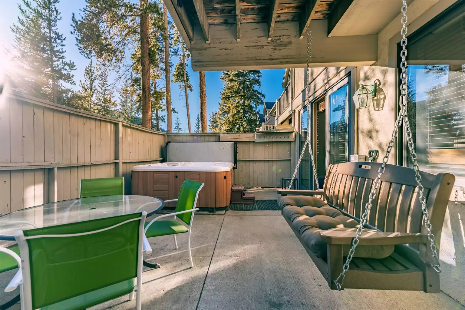 Private patio with hot tub and swing