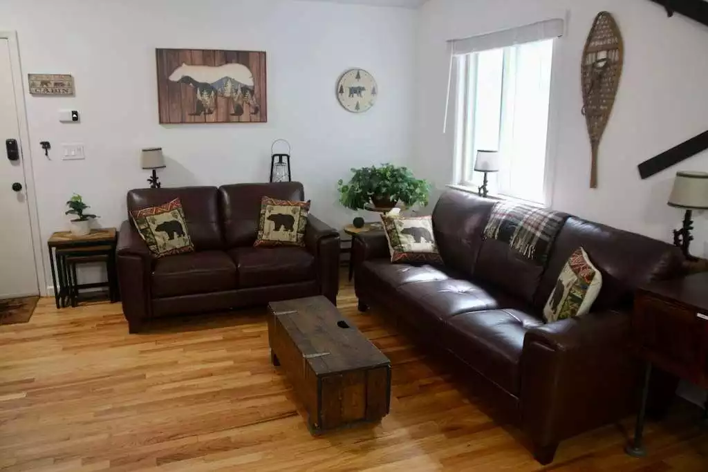 Living room with ample seating for all. - Escape to a 3-Bedroom Cabin in Lower Catskills - Woodridge