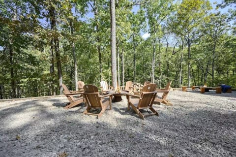 Industrial firepit with comfortable Adirondack chairs 