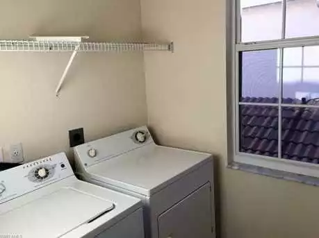 Laundry room in condo