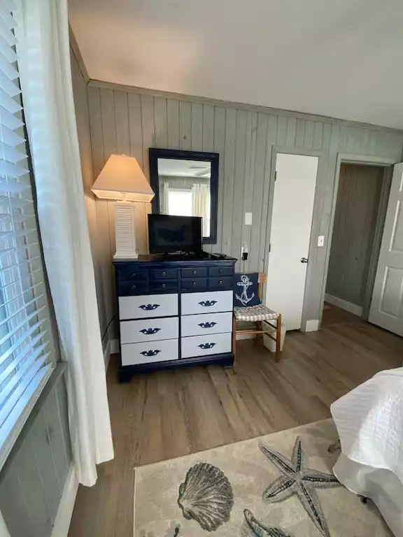 Bedroom 3 of 5 - King bed -  upstairs/NW - faces back/side yard - cable TV, dresser, (2) nightstands - Charming Litchfield Beach, Pawley’s Island SC home - Pawleys Island