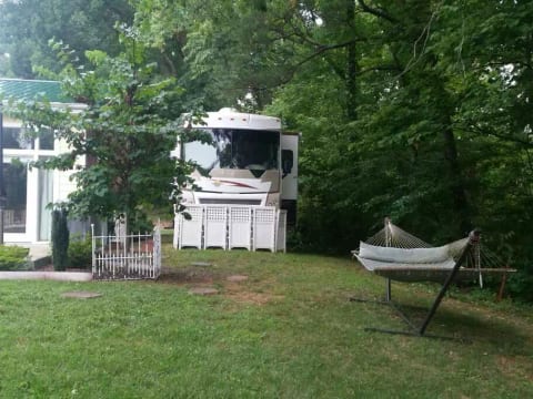 Actual location of RV next to main building where there are larger common living and dinning rooms for your use.
