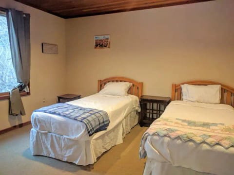 Our two twin beds. Extra blankets and pillows are available in the closet and shelf.