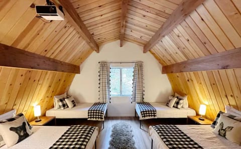 Upstairs - open loft with 4 twin beds.