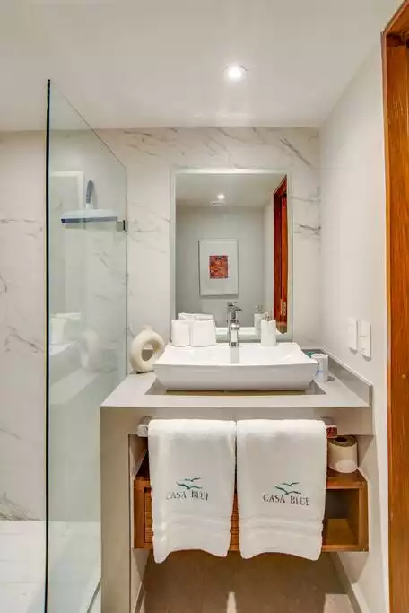 Detailed accents such as embroidered towels.