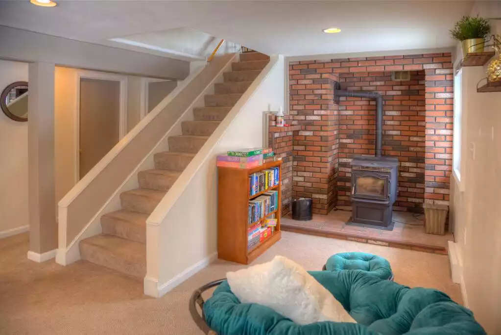 Living room facing pellet stove - Long Lake Escape, fun in all four seasons. - Bridgton