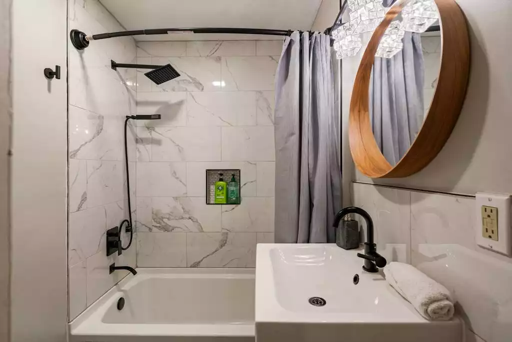First bath on main level with shower/tub combination First bath on main level with shower/tub combination - House over The Pond w/ Game Rooms, Views - Basye