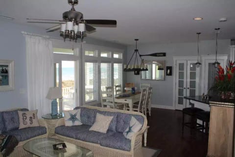 Main living level showing seating and dining area.