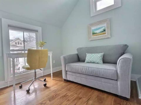 Desk and sitting area with courtyard view in second bedroom