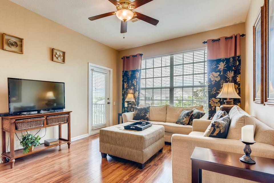 Warm and inviting living area with large flat screen TV.
