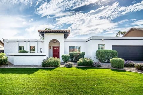 Completely re-painted and landscaped front of house. Bright happy white!