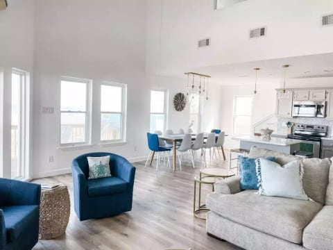 Dining area with seating for 10 at table and 3 at bar