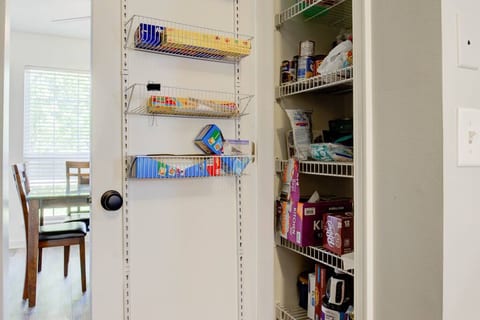 Store all your dry good and pantry items in the full-length kitchen pantry