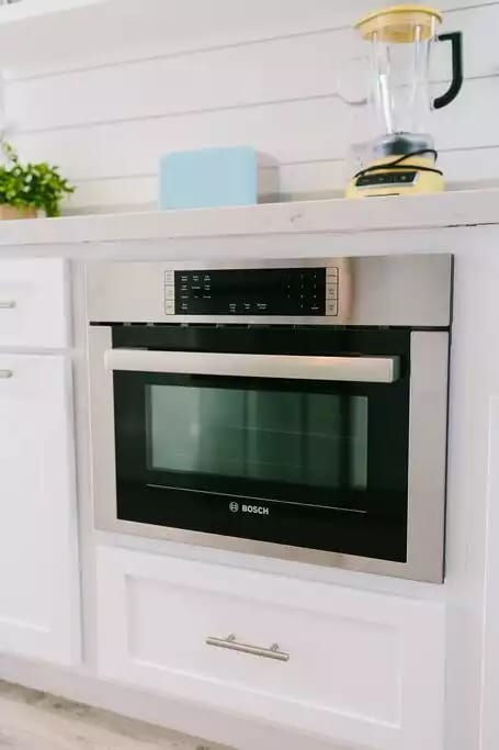 A new Bosch speed oven operates as both a microwave and fully functional oven.  An induction burner is also available.