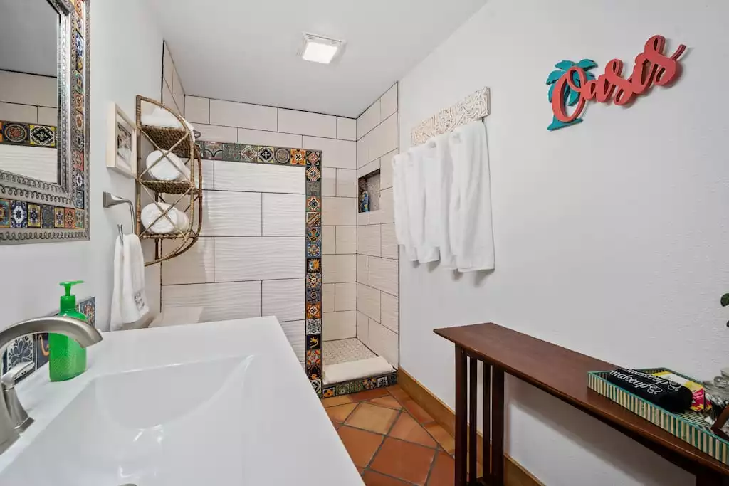 Large walk-in shower, soft towels, all the bathroom amenities, including a hair dryer.  
Awesome makeup lighting! - The Beachcomber -Lubbock, TX with an Island Flair! - Lubbock