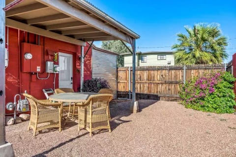 A front yard with off the street parking and a covered sitting area to enjoy the twilight or an afternoon chat.
