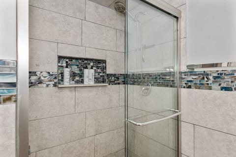 The shower is modern and stylish.