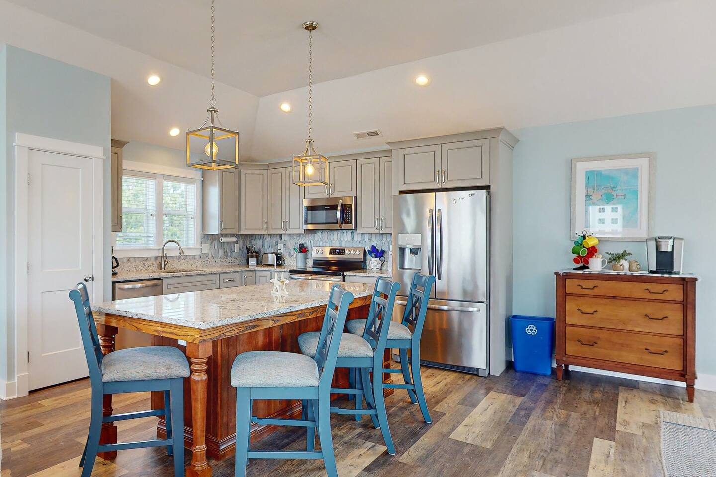 Culinary paradise awaits! Our kitchen features stainless steel appliances, sleek granite countertops, a spacious island with seating.