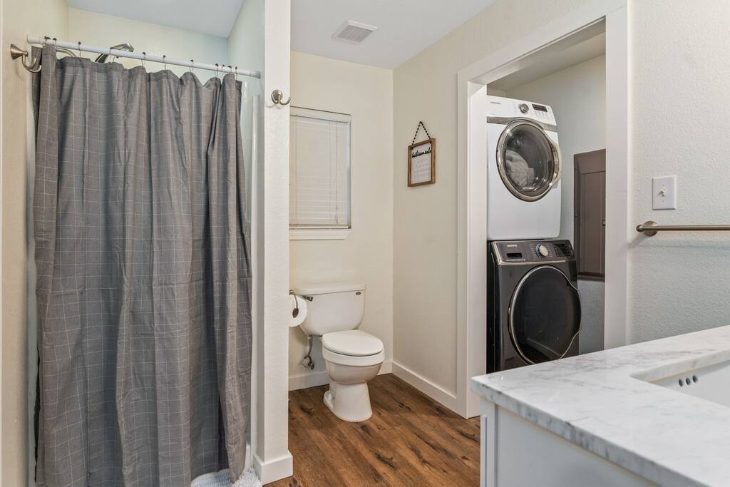 Primary bathroom has shower and W/D access. 