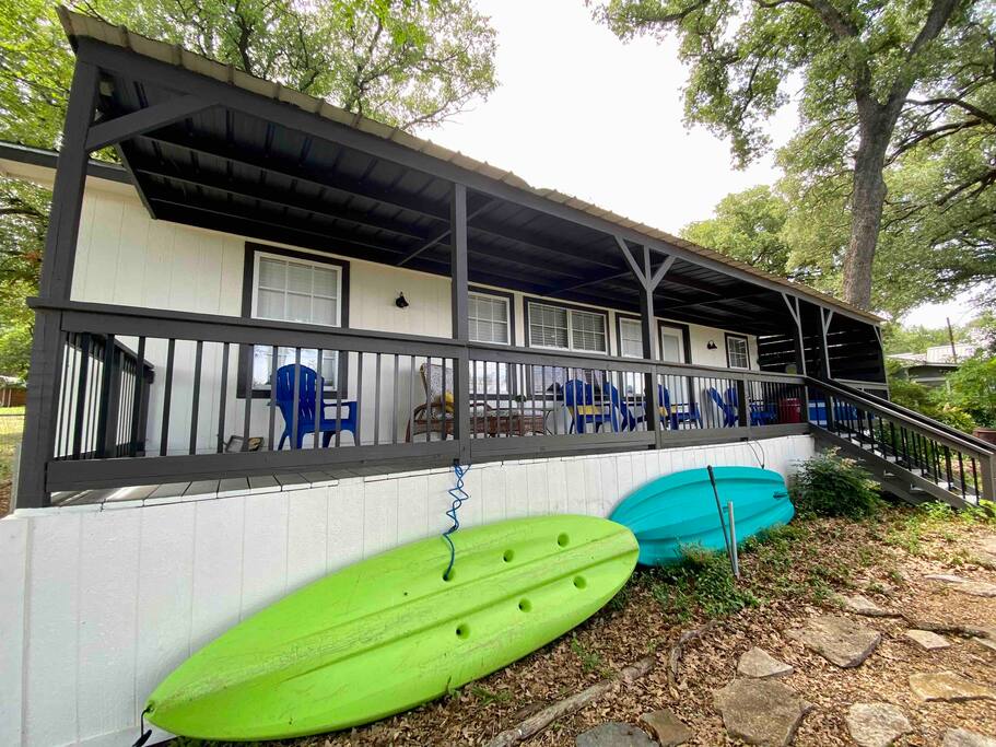 Kayaks are conveniently stored next to the back porch.