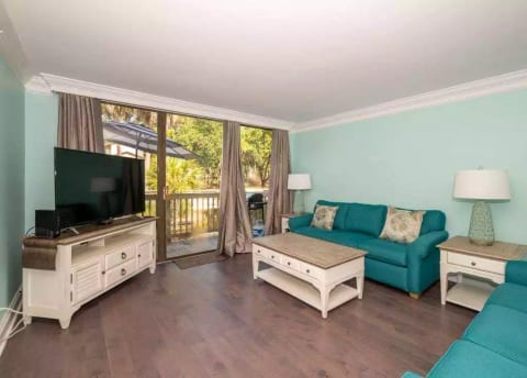 Seascape Villas 3247 - Living Area - The Living Room Area has sliding door access to the beautiful wooded area deck with grill. Upscale furnishings and a flat screen television complete the space.
