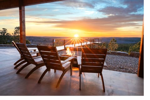 You'll love sitting and watching the sunsets from the covered porch, and you can even cozy up by our convenient gas fire pit, rain or shine. 