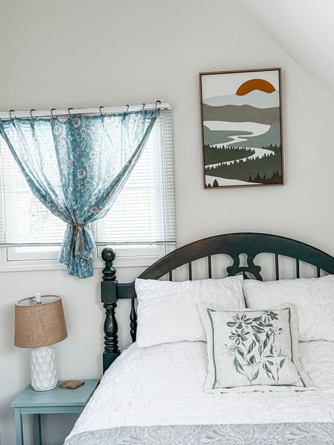 Comfy queen-sized bed with easy access to full bath