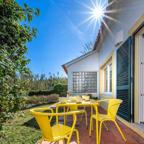 A peaceful corner perfect for morning coffee or evening wine, right at the edge of the garden.